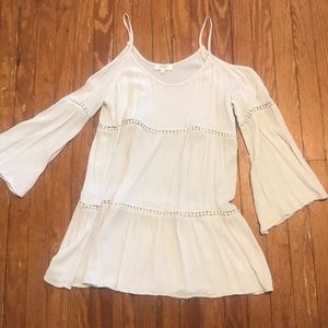 Cream tunic with open shoulders and flared arms